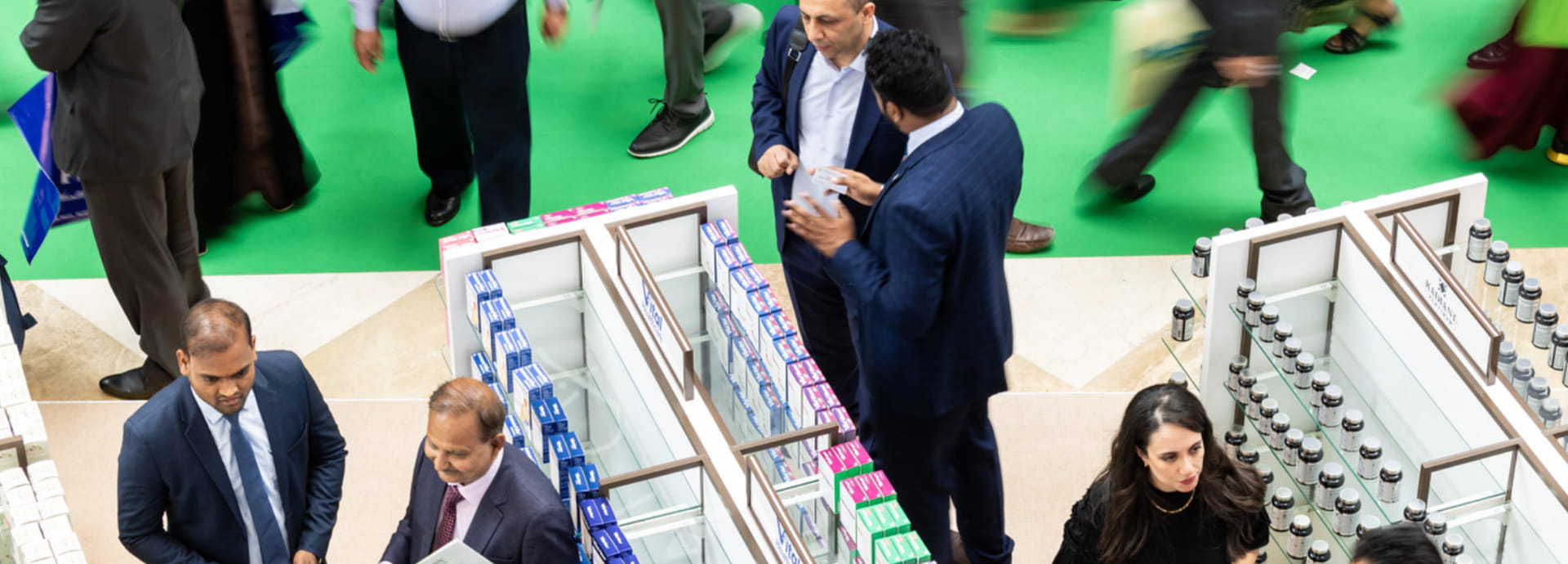  Delegates and attendees at an exhibitor stand