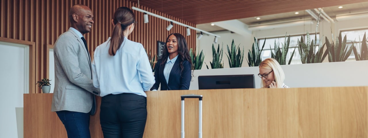 People checking into a hotel